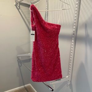 This is a pink, sparkly dress designed and made by Berlinnova.